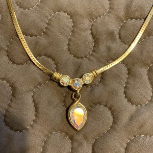 Gold necklace with iridescent stones